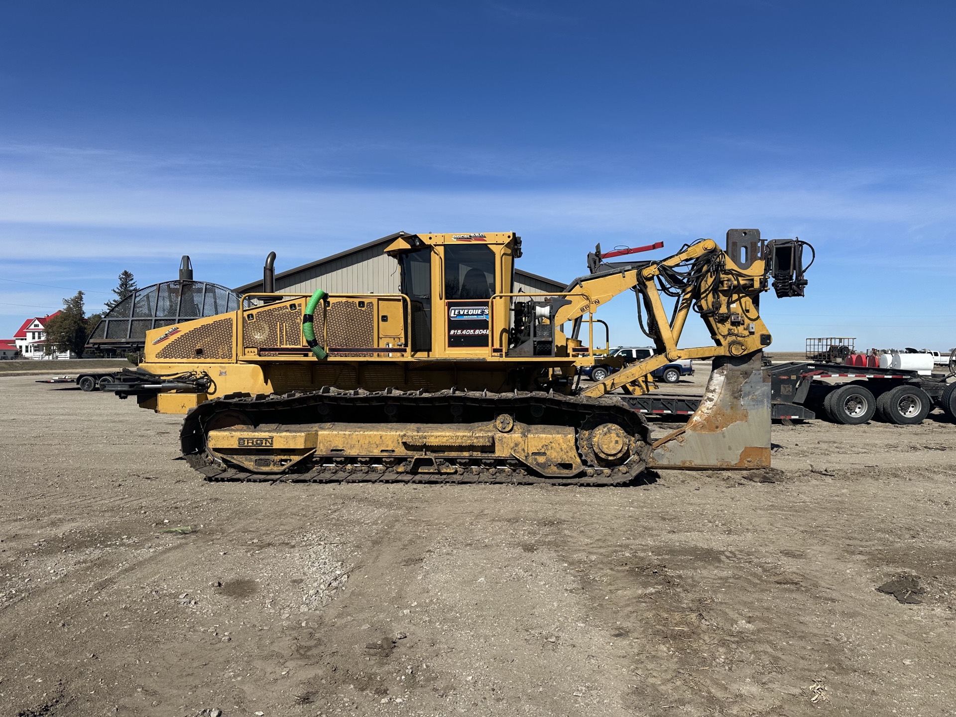 Excavating contractor Melbourne, IA Yellow BRON tiling plow — excavating contractor Melbourne, IA
